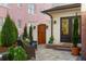 Cozy patio with comfortable seating, a wooden gate, and access to the main house with a glass door at 346 16Th Ne Ave, St Petersburg, FL 33704