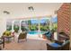 Outdoor patio boasts a pool view, brick fireplace, and ample seating at 346 16Th Ne Ave, St Petersburg, FL 33704