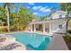 The beautiful pool is surrounded by lush landscaping, creating a private and serene backyard retreat with covered patio at 346 16Th Ne Ave, St Petersburg, FL 33704