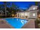 Refreshing backyard pool with a patio, perfect for relaxation and entertaining in the evening at 346 16Th Ne Ave, St Petersburg, FL 33704