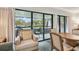 Inviting seating area with balcony access offering a view of the building's exterior at 36750 Us 19 N # 19212, Palm Harbor, FL 34684