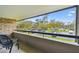Relaxing balcony view overlooks parking and grassy area at 36750 Us 19 N # 19212, Palm Harbor, FL 34684