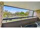 View from balcony overlooking well-kept parking and grassy area at 36750 Us 19 N # 19212, Palm Harbor, FL 34684