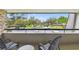 Balcony with comfortable seating and a scenic view of the parking and greenery at 36750 Us 19 N # 19212, Palm Harbor, FL 34684