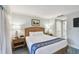 Comfortable bedroom offering a restful sleeping space with nightstands, and convenient bathroom access at 36750 Us 19 N # 19212, Palm Harbor, FL 34684