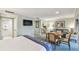 Spacious suite showcasing a bed, living area, kitchenette, and access to a bathroom and outdoor balcony at 36750 Us 19 N # 19212, Palm Harbor, FL 34684