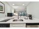 Bright kitchenette with modern appliances and ample counter space, perfect for in-room dining at 36750 Us 19 N # 19212, Palm Harbor, FL 34684