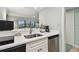 Convenient kitchenette featuring modern appliances, counter space, and easy access to in-room dining amenities at 36750 Us 19 N # 19212, Palm Harbor, FL 34684