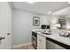 Contemporary kitchenette featuring stainless steel appliances, bright lighting, and ample counter space at 36750 Us 19 N # 19212, Palm Harbor, FL 34684