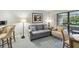 Inviting living area features comfortable seating, natural light, and easy access to the balcony at 36750 Us 19 N # 19212, Palm Harbor, FL 34684