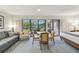 Bright living area with a dining table, large windows, and a comfortable seating arrangement at 36750 Us 19 N # 19212, Palm Harbor, FL 34684