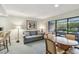 Inviting suite with sofa, table with chairs, a convenient kitchenette, and access to an outdoor balcony at 36750 Us 19 N # 19212, Palm Harbor, FL 34684