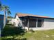 Features a screened-in porch and a well-maintained lawn, perfect for outdoor enjoyment and relaxation at 3704 Haven Dr, New Port Richey, FL 34652