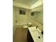 Bathroom featuring a tub and shower combination, updated toilet, vanity and mirror at 3704 Haven Dr, New Port Richey, FL 34652