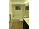 Bathroom featuring a tub and shower combination, updated toilet, vanity and mirror at 3704 Haven Dr, New Port Richey, FL 34652