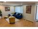 Inviting living room featuring hardwood floors, recessed lighting, and comfortable contemporary furnishings at 3704 Haven Dr, New Port Richey, FL 34652