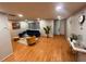 Bright and modern living room showcasing hardwood floors, recessed lighting, and stylish decor at 3704 Haven Dr, New Port Richey, FL 34652