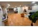 Spacious living area with wood flooring and views to the modern kitchen at 3704 Haven Dr, New Port Richey, FL 34652