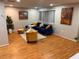 Inviting living room featuring hardwood floors, recessed lighting, and comfortable contemporary furnishings at 3704 Haven Dr, New Port Richey, FL 34652