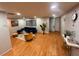 Bright and modern living room showcasing hardwood floors, recessed lighting, and stylish decor at 3704 Haven Dr, New Port Richey, FL 34652