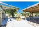 The backyard features a covered patio, water feature, and ample space for outdoor activities at 412 River S Blvd, Nokomis, FL 34275
