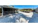 A serene backyard retreat with a covered patio and ample space for entertaining guests at 412 River S Blvd, Nokomis, FL 34275