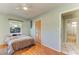 Bedroom with hardwood floors and closet space, adjacent to the bathroom at 412 River S Blvd, Nokomis, FL 34275