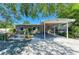 Inviting single-story home with shaded carport and landscaped front yard at 412 River S Blvd, Nokomis, FL 34275