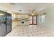 Kitchen with white cabinets, modern appliances, and access to the screened patio at 412 River S Blvd, Nokomis, FL 34275