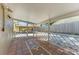 Covered patio featuring decorative tile flooring and an inviting outdoor lounge area at 412 River S Blvd, Nokomis, FL 34275