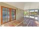 Screened patio with patterned tile, perfect for enjoying the outdoors comfortably at 412 River S Blvd, Nokomis, FL 34275