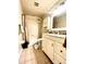 Well-lit bathroom with a shower-tub combination and a single sink vanity at 430 Larboard Way # 3, Clearwater Beach, FL 33767