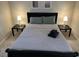 Cozy bedroom featuring a comfortable bed with stylish gray bedding and side tables with lamps at 430 Larboard Way # 3, Clearwater Beach, FL 33767