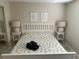 Well-lit bedroom featuring a comfortable bed with stylish seashell bedding and side tables with lamps at 430 Larboard Way # 3, Clearwater Beach, FL 33767