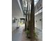 A well maintained condo exterior with tropical foliage and view of the water at 430 Larboard Way # 3, Clearwater Beach, FL 33767