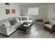Cozy living room boasts stylish neutral decor, comfortable seating, and ample natural light at 430 Larboard Way # 3, Clearwater Beach, FL 33767