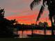 Waterfront view showcasing a vibrant sunset sky reflected in the water at dusk at 430 Larboard Way # 3, Clearwater Beach, FL 33767