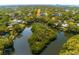 High angle captures a residential area enveloping a lake and an island covered with trees and vegetation at 4605 W Vasconia St, Tampa, FL 33629