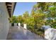 Tile balcony with wrought iron railing overlooking lush landscaping and a tranquil bayou at 4605 W Vasconia St, Tampa, FL 33629
