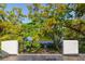 View from the balcony over lush mature trees down to the waterfront at 4605 W Vasconia St, Tampa, FL 33629
