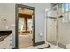 Bathroom features a sleek glass shower and tiled floor at 4605 W Vasconia St, Tampa, FL 33629
