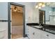 Well-lit bathroom features a granite countertop and white vanity at 4605 W Vasconia St, Tampa, FL 33629