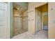 Bathroom with a glass-enclosed shower, tile surround, and tile floor at 4605 W Vasconia St, Tampa, FL 33629