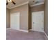 Empty bedroom with neutral colored walls and carpet at 4605 W Vasconia St, Tampa, FL 33629