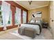 Stylishly furnished bedroom with a large windows and a ceiling fan at 4605 W Vasconia St, Tampa, FL 33629