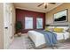 Comfortable bedroom with a large bed, stylish decor and dual-paned windows at 4605 W Vasconia St, Tampa, FL 33629