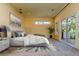 Bright, sunny bedroom with neutral colors and access to a private balcony at 4605 W Vasconia St, Tampa, FL 33629