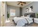 Stylishly furnished bedroom with modern decor and large dual-paned window at 4605 W Vasconia St, Tampa, FL 33629