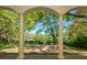 A picturesque covered patio with views of the serene waterfront and lush greenery at 4605 W Vasconia St, Tampa, FL 33629