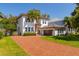 Lovely home with a brick driveway, two-car garage, and manicured lawn, offering a welcoming curb appeal at 4605 W Vasconia St, Tampa, FL 33629